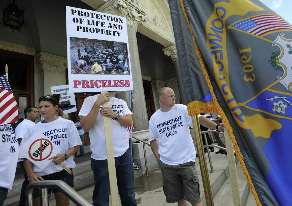 The Connecticut State Police Union holds a rally at the Capitol in Hartford, Conn., Monday, Aug. 22, 2011. Union leaders say state police are already understaffed and cutting 56 troopers is a dangerous proposal that could result in slower emergency response times. After state police refused to accept a wage freeze, the governor laid off more than 50 troopers.