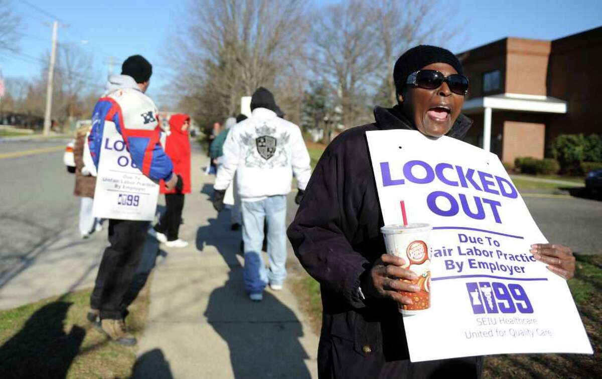 Employee Patricia Guthrie, of Bridgeport, protests with other members of the New England Health Care Employees Union Tuesday, Dec. 13, 2011 outside West River Health Care Center in Milford, Conn. Employees were locked out for failure to deliver a final contract by October 27, 2011.