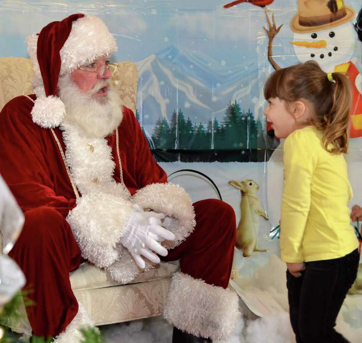 Three-year-old Lisa Mallozzi is simply and totally excited at her chance to talk to Santa at the Nature Center's Winter Wonderland.