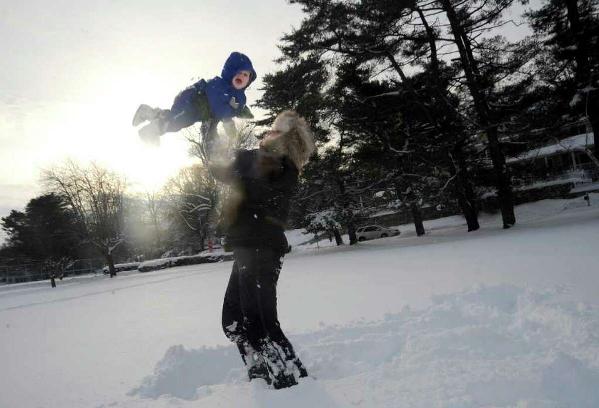Susannah Sullivan, of Old Greenwich, plays in the snow with her daughter India, 11 months, in Binney Park, in Old Greenwich, on Wednesday, Jan. 12, 2011.