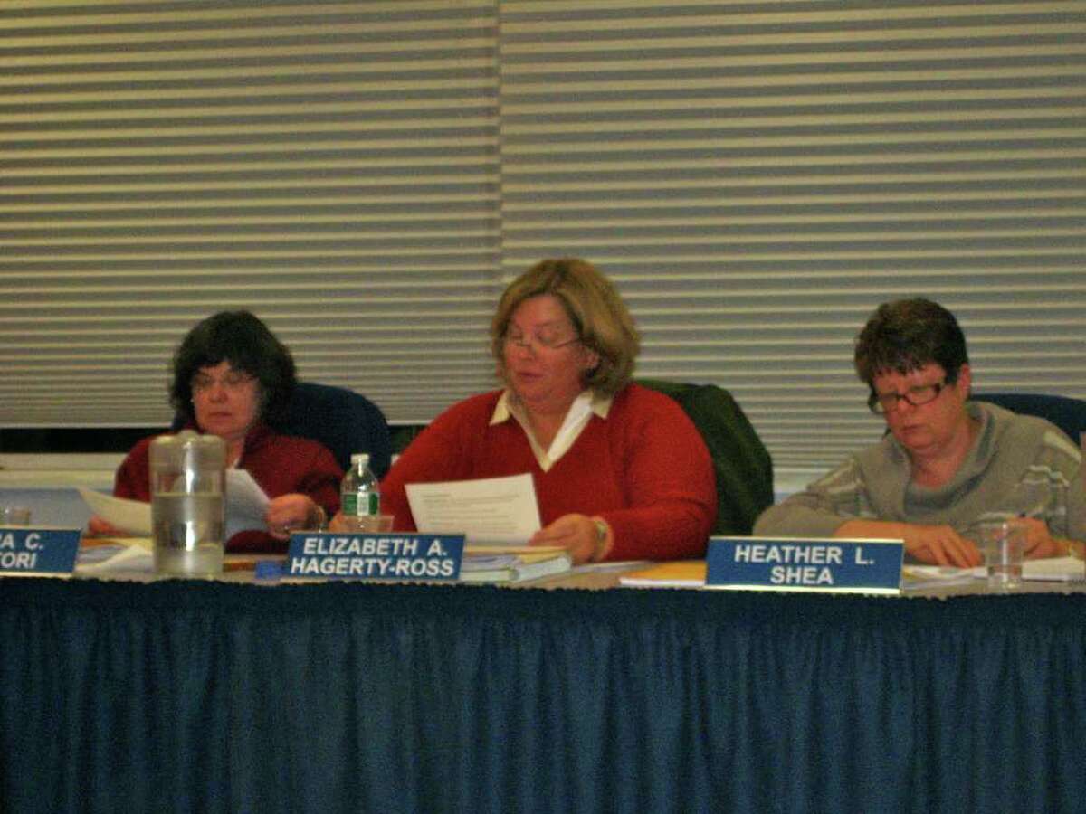 Board of Education members Clara Sartori, Elizabeth Hagerty-Ross and Heather Shea review the world language proposal at Tuesday night's meeting. Photo by Thomas Michael