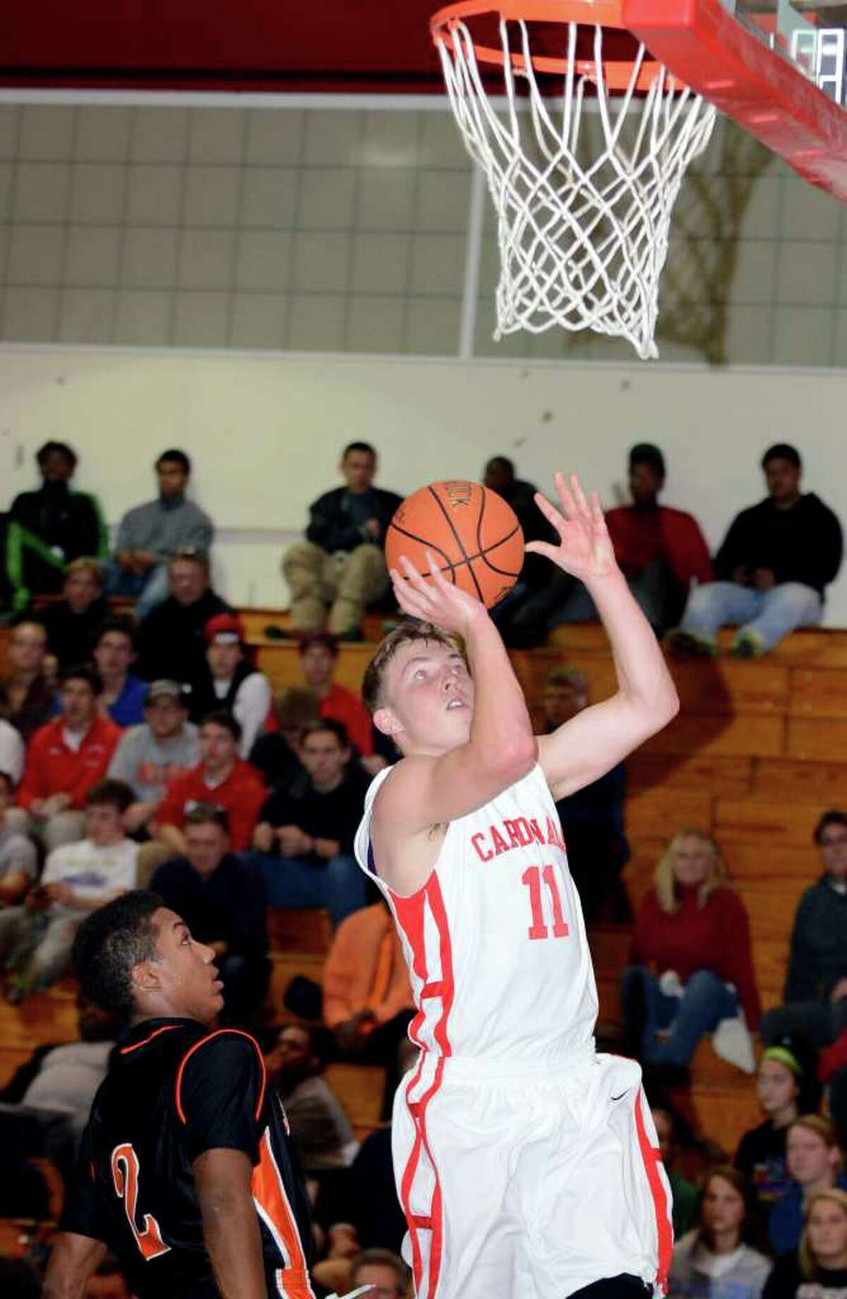 Greenwich's Alex McMurray (11) goes up for a shot during the boys basketball game against Stamford at Greenwich High School on Wednesday, Dec. 14, 2011.