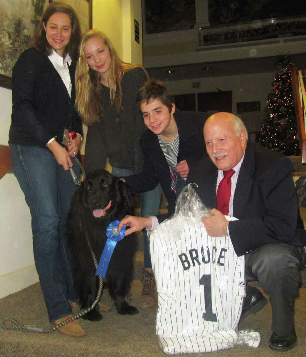 Bruce, a 150-pound Lab-Newfoundland mix, won Westport Animal Shelter Advocates' "Top Dog" contest Thursday afternoon. From left to right is owner Jennifer Purdy, Purdy's daughter Tova, son Declan and First Selectman Gordon Joseloff.