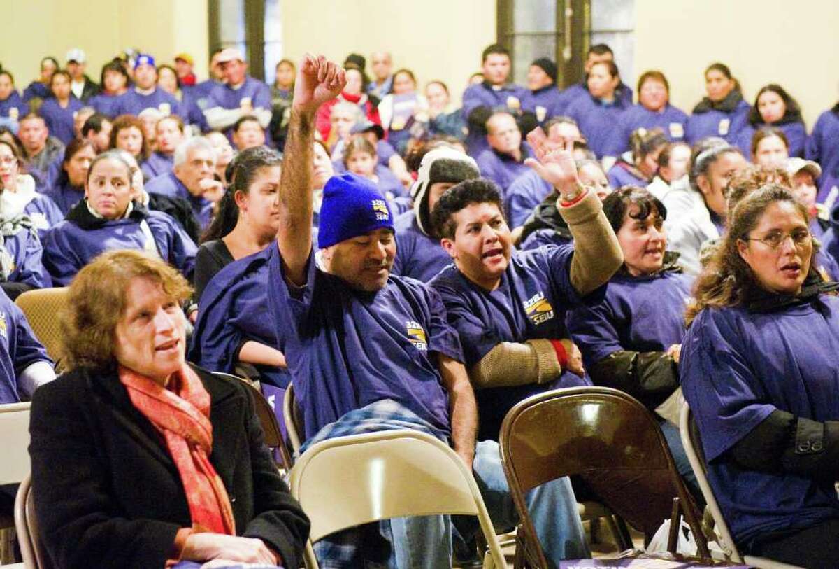 Hundreds of Fairfield County office cleaners gather to hold a vote on whether to authorize their union's bargaining committee to call a strike at the Unitarian Church in Stamford, Conn., December 15, 2011. Negotiations for a new contract covering more than 1,500 commercial office cleaners in Fairfield County and another 1,700 cleaners in Hudson Valley began on November 10th between 32BJ SEIU and representatives for the area's major commercial office building owners, managers, and cleaning companies.32BJ members clean prominent buildings in Fairfield County including the University of Connecticut, the UBS Building, the RBS Building, Norwalk Community College and Fairfield University. The contract is set to expire at 12:01 AM on January 1, 2012.