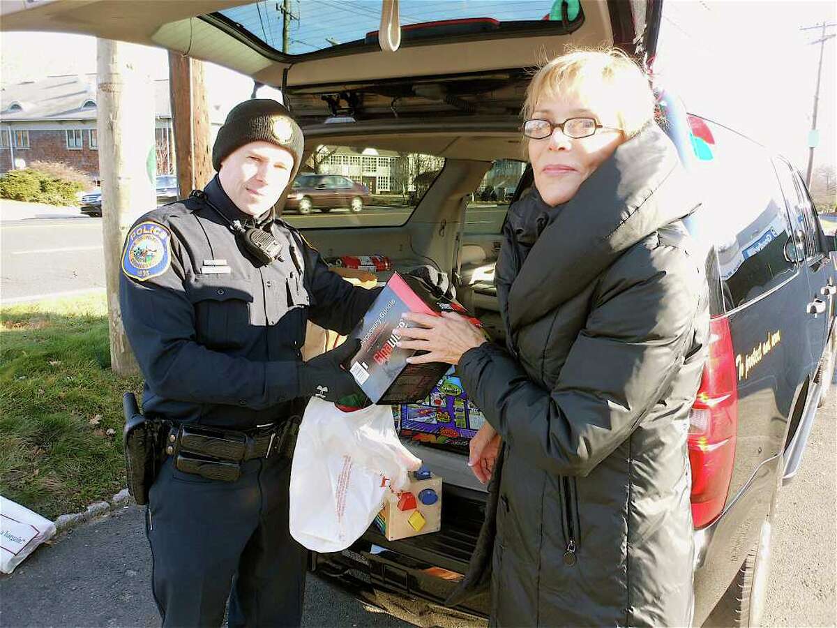Santa's bluesuited elves in Westport collect toys for needy