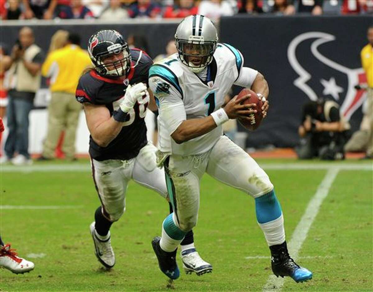 Carolina Panthers quarterback Cam Newton (1) evades Houston Texans outside linebacker Brooks Reed (58) during the third quarter of an NFL football game Sunday, Dec. 18, 2011, in Houston. (AP Photo/Dave Einsel)