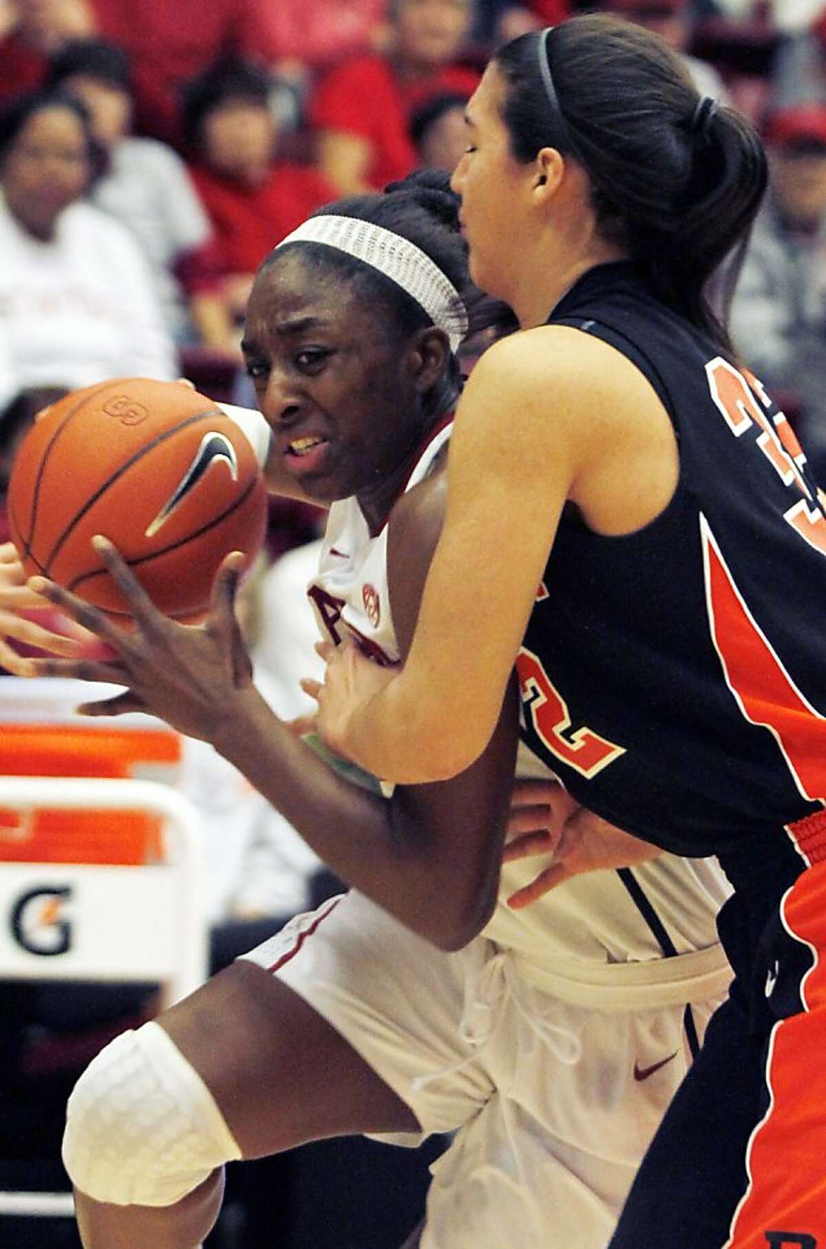 Stanford's Nnemkadi Ogwumike, left, drives against Princeton's Kristen Helmstetter during the second half of an NCAA college basketball game, Saturday, Dec. 17, 2011 in Stanford, Calif. Stanford defeated Princeton 85-66. (AP Photo/George Nikitin)