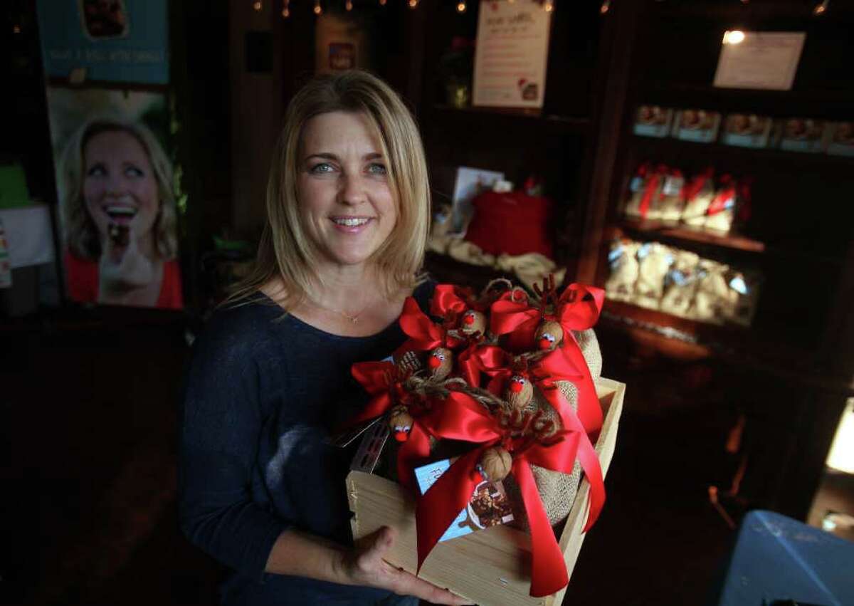 Mayra Beltran : Chronicle SWEET TIME OF THE YEAR: Robin Strickland, owner of Big Little Fudge, sells 13 varieties of fudge at her temporary, 200-square-foot store at Market Square in The Woodlands. Strickland has a permanent store in Montgomery.