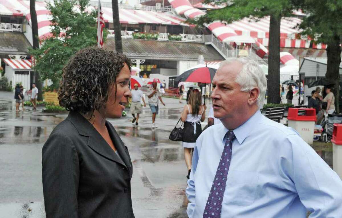 Ellen McClain, executive vice president and chief operating officer of NYRA, speaks with Charles Hayward, president and CEO of NYRA, at the Saratoga Race Course in Saratoga Springs, N.Y. Aug. 8, 2011. (Skip Dickstein / Times Union archive)