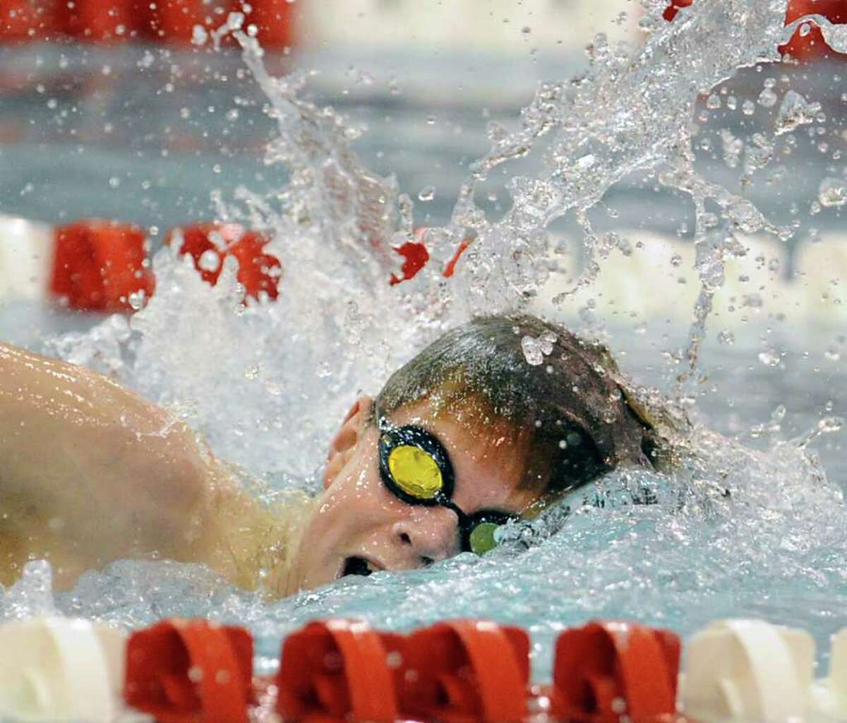 Swimmer Thomas Dillinger of Greenwich High School competes in the 200 freestyle event boys swim meet between Greenwich High School and New Canaan High School at Greenwich High School, Tuesday, Dec. 20, 2011.