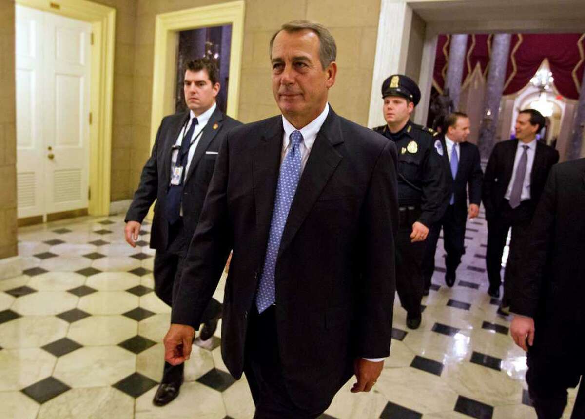 House Speaker John Boehner of Ohio walks of the floor of the House chamber on Tuesday, Dec. 20, 2011, in Washington. The House rejected legislation to extend a payroll tax cut and jobless benefits for two months, drawing a swift rebuke from President Barack Obama that Republicans were threatening higher taxes on 160 million workers on Jan. 1. (AP Photo/Evan Vucci)