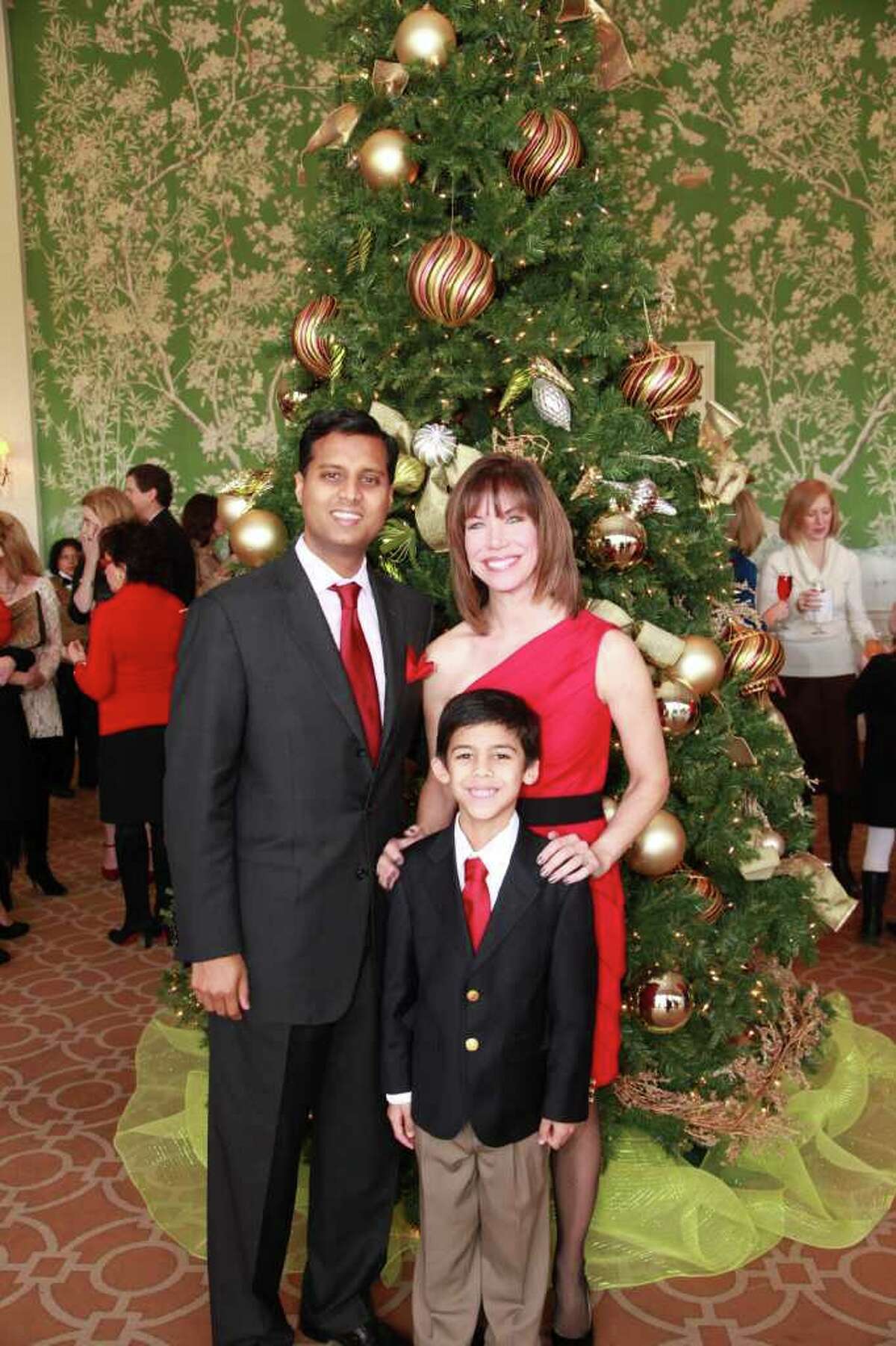 Roseann Rogers, her husband, Dr. Aashish Shah, and son Nikhil chaired A Cardinal's Christmas luncheon benefiting Catholic Charities.