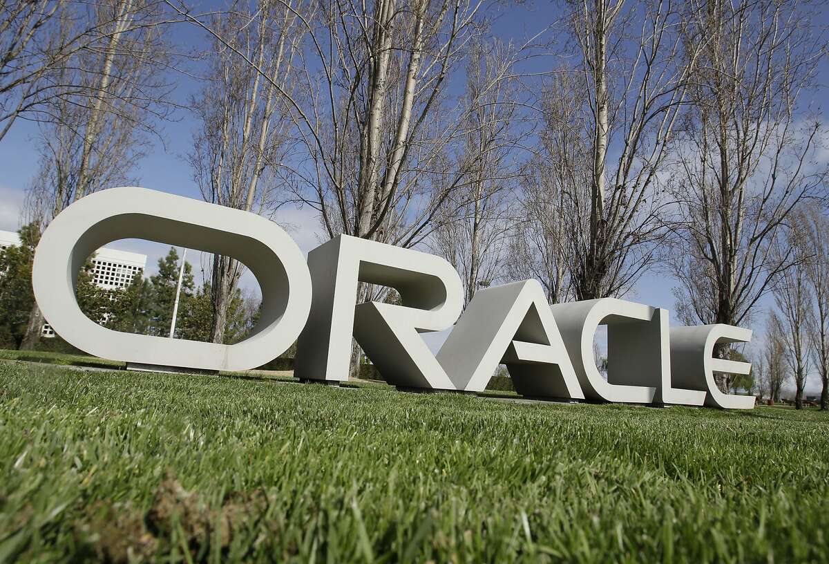 The company logo for Oracle Corp. headquarters is shown in Redwood City, Calif.