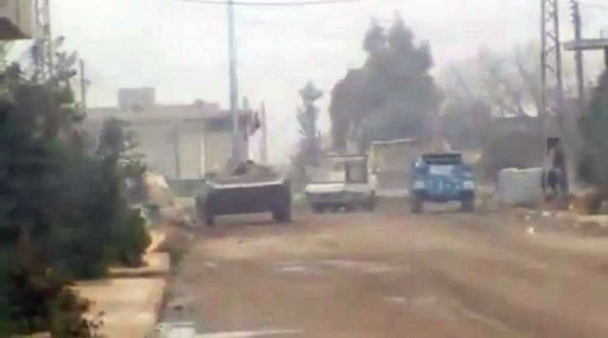 In this image from amateur video made available by the Ugarit News group on Wednesday, Dec. 21, 2011, purports to show military vehicles in Homs, Syria. (AP Photo/Ugarit News Group via APTN) THE ASSOCIATED PRESS CANNOT INDEPENDENTLY VERIFY THE CONTENT, DATE, LOCATION OR AUTHENTICITY OF THIS MATERIAL, TV OUT