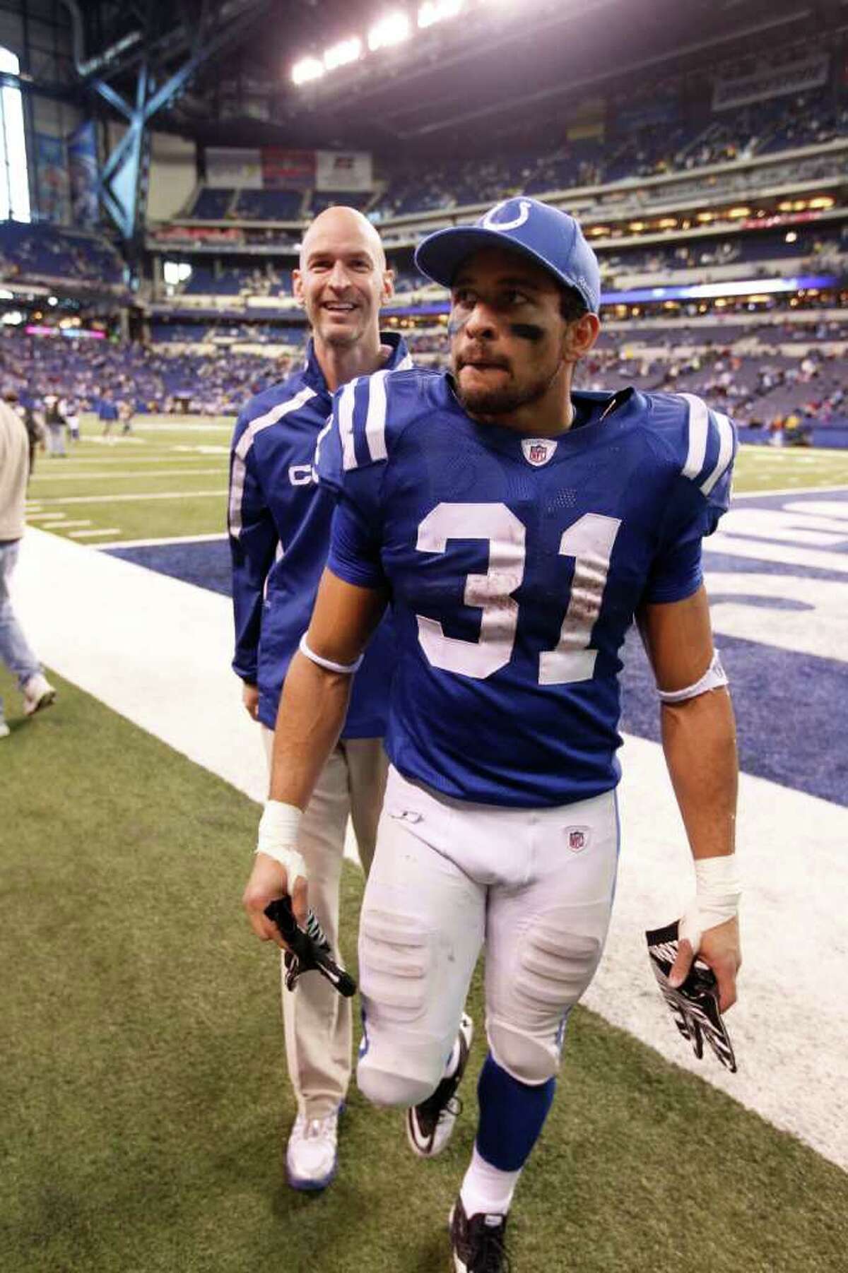 Indianapolis Colts running back Donald Brown leaves the field after the team's first win of the season in an NFL football game in Indianapolis, Sunday, Dec. 18, 2011. The Colts won 27-13. (AP Photo/Michael Conroy)