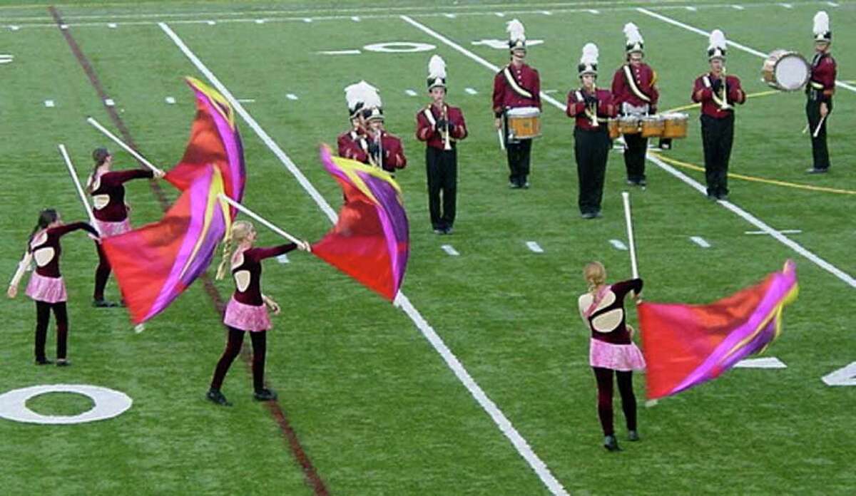The Bethel High School marching band and Color Guard perform during a competition in September.
