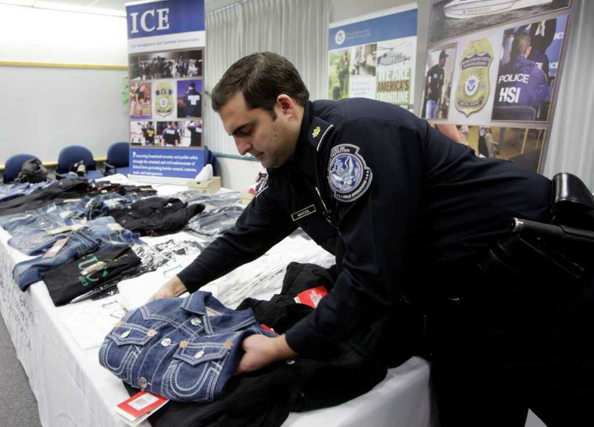 Some of the counterfeit goods seized by federal agencies in Operation Holiday Hoax II are displayed in Los Angeles by Immigration and Customs Enforcement agents. The operation rounded up a total of $76.8 million worth of items.
