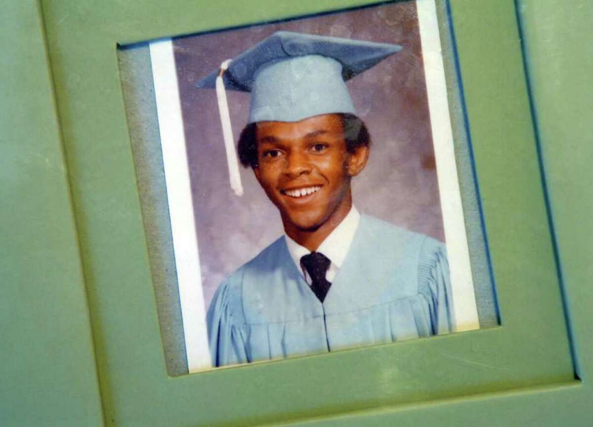A graduation photo of Timothy Cole is displayed in his family's home.