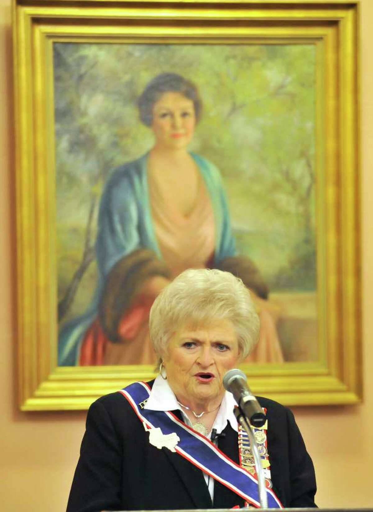 DRT President General Karen Thompson speaks in front of a well-known portrait of Clara Driscoll in this photo from December 2011.