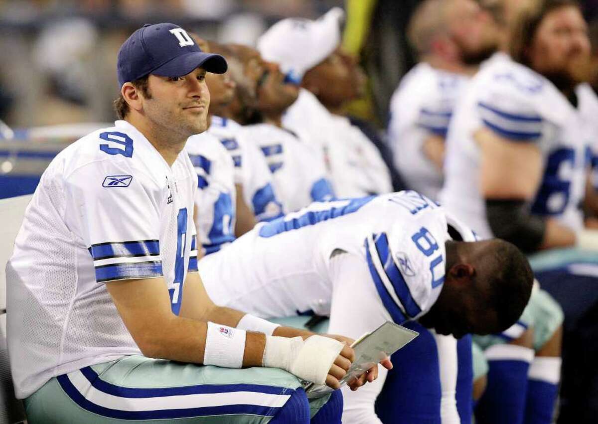 Dallas Cowboys' Tony Romo sits on the bench after injuring his right hand during first half action against the Eagles Saturday Dec. 24, 2011 at Cowboys Stadium in Arlington, TX. PHOTO BY EDWARD A. ORNELAS/eaornelas@express-news.net)