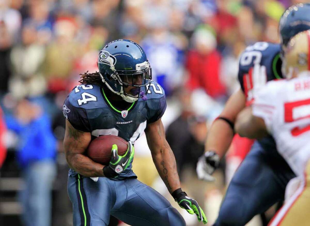 Seattle Seahawks' Marshawn Lynch carries against the San Francisco 49ers in the first half of an NFL football game Saturday, Dec. 24, 2011.