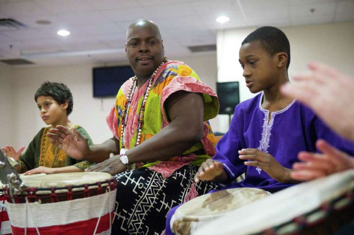 Brother Henry Jones leads the Infinite Roots Ethnic Drumming and Dance Troupe as Stamford Kwanzaa Association celebrates its 11th Annual Umoja (Unity) Community Celebration kicking off the week of Kwanzaa at the Faith Tabernacle Baptist Church in Stamford, Conn., December 26, 2011. The Stamford Kwanzaa celebrations will continue with events each day beginning Tuesday at 2 with the film, The Black Candle, at the Ferguson Library South End Branch. Wednesday features two events focusing on collective work and responsibility, one at the Government Center at 2 and a second at Bethel A.M.E. Church at 6:30 P.M. Thursday, the focus will be collective economics at the Chester Addison Community Center at 5 P.M. And Friday at noon, purpose will be the topic at CTE, Inc., on Woodland Avenue. The week's events are co-sponsored by the Friends of the Ferguson Library, the Community Arts Partnership Program and the City of Stamford. For more information about these events, contact Josephine Fulcher-Anderson at (203) 351-8280.