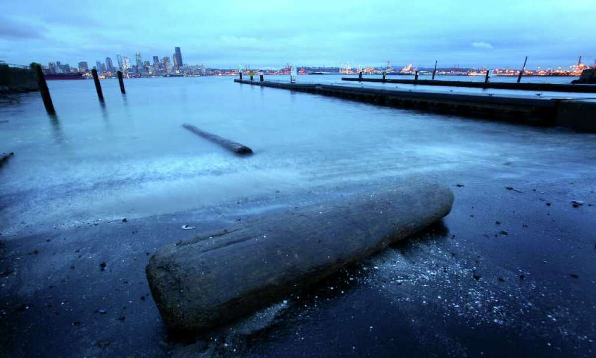 A "king tide" reaches its peak at Seattle's Alki Beach on Tuesday, December 27, 2011. King tides are a natural phenomenon that occur once or twice a year when the sun and moon’s gravitational pulls reinforce one another. They happen when the moon is closest to the earth.
