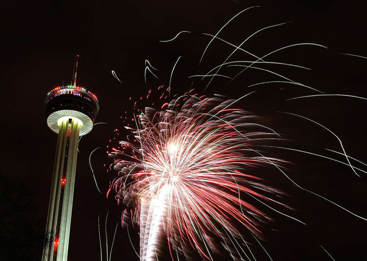 Fireworks erupt near the Tower of Americas to celebrate the New Year in 2011.