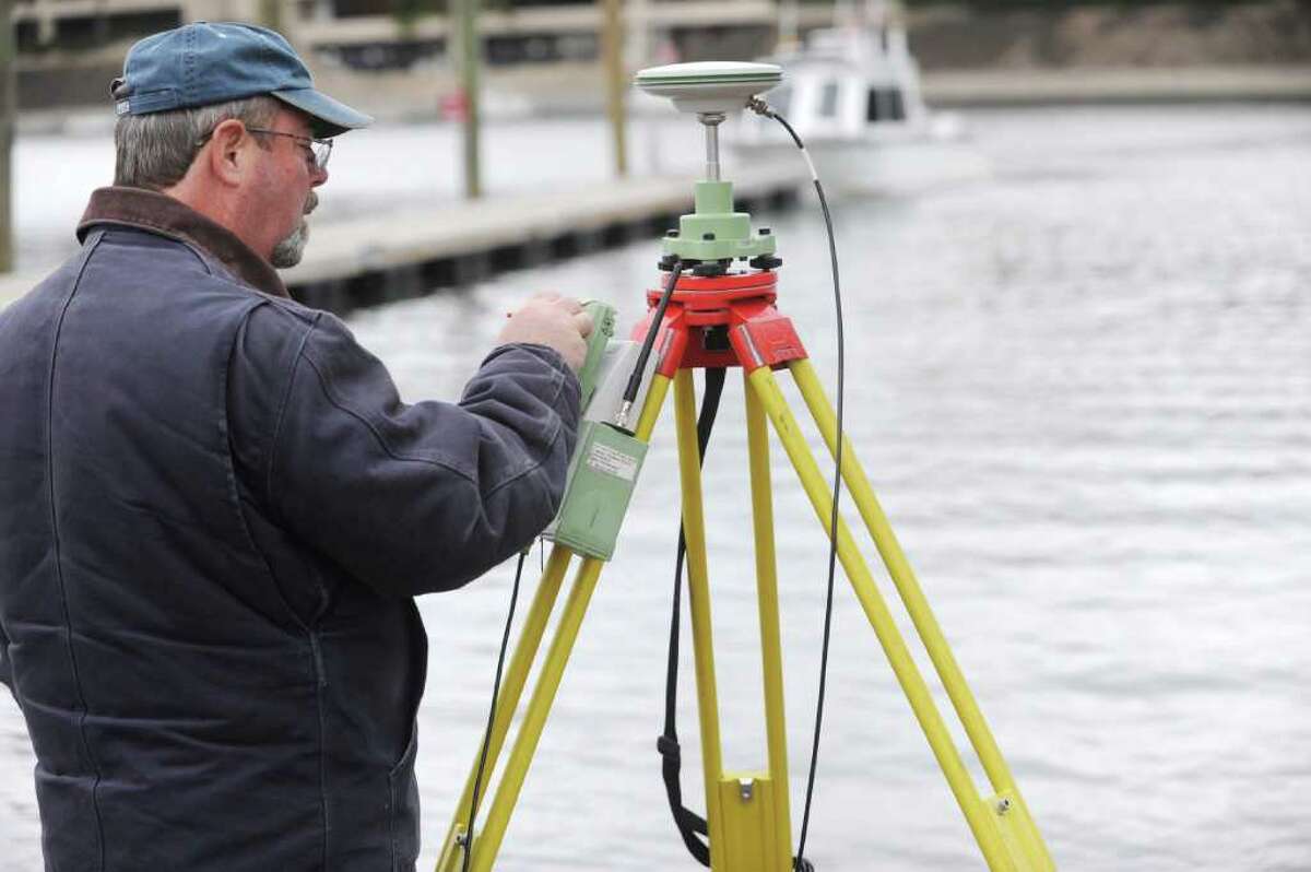Paul Cohn, of the U.S. Army Corps of Engineers, uses a GPS device to track the tide at Grass Island. A U.S. Army Corps of Engineers boat was in Greenwich Harbor Tuesday, Dec. 27, 2011, surveying the condition of the harbor, which could be dredged for the first time in 50 years, the Greenwich harbormaster said.
