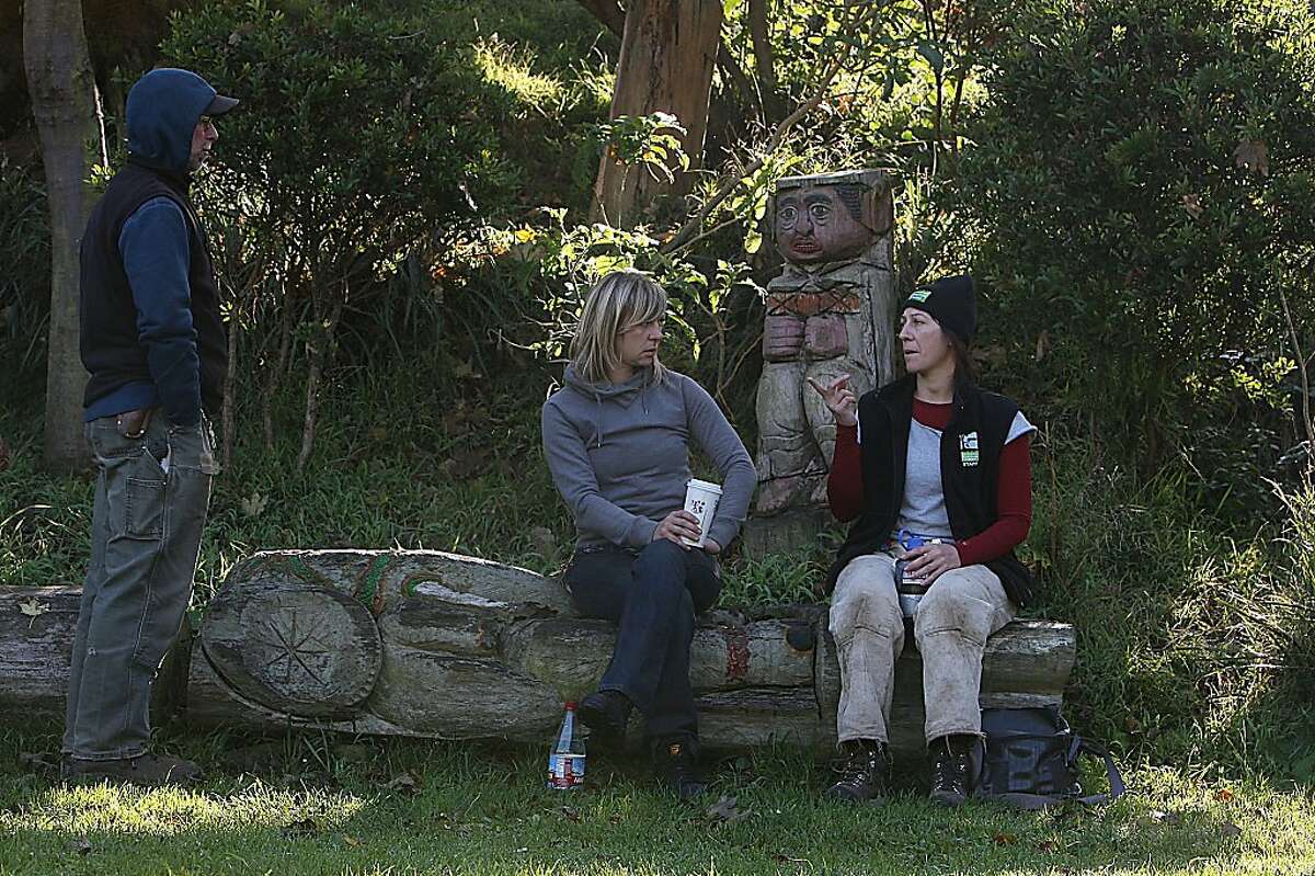 Randy Zebell, Jenny Rae, and Kirra Swenerton having lunch at Cayuga park in San Francisco, Calif., on Wednesday, December 14, 2011. A planned $9 million restoration of Cayuga Park will include refurbishing more more than 130 wood sculptures that Braceros, a retired city gardener, did during his 20-plus years at the park.