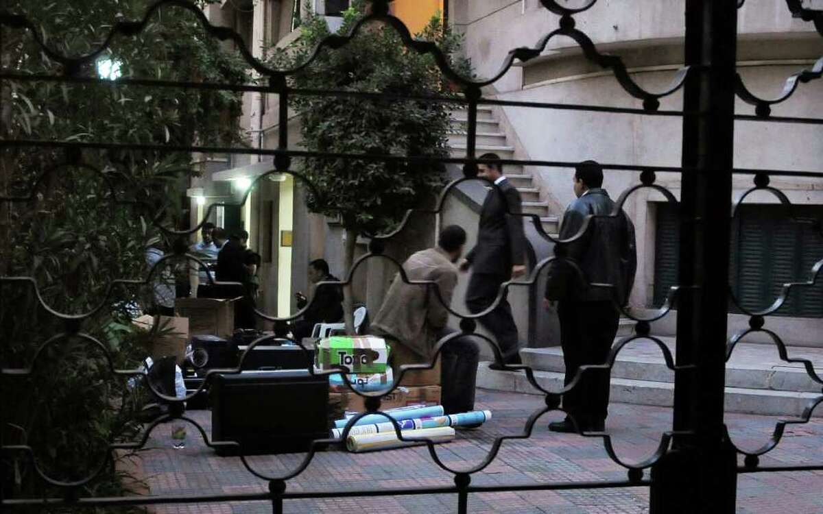 Egyptian police raid a nongovernmental organization office in Cairo, banning employees inside from leaving while they interrogate them and search through computer files.