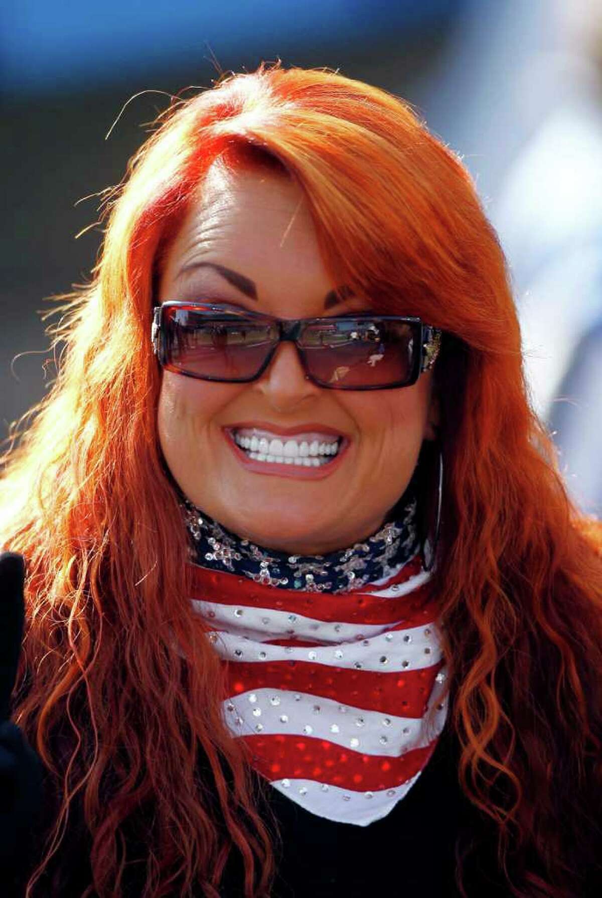 FILE- In this Sunday, Dec. 11, 2011 file photo, Wynonna Judd waits on the sidelines before singing the national anthem at an NFL football game between the New Orleans Saints and the Tennessee Titans in Nashville, Tenn. Judd is engaged to her boyfriend, the drummer for the country group Highway 101. Judd, 47, and Cactus Moser, 54, got engaged Dec. 24. (AP Photo/Wade Payne, File)