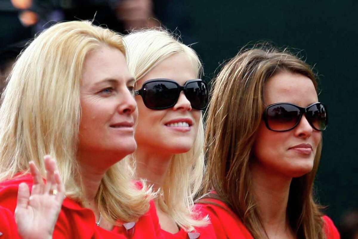 Nicki Stricker (from left), Elin Woods and Yvette Prieto of the the USA Team are seen during the Opening Ceremonies of The Presidents Cup at Harding Park Golf Course on October 7, 2009 in San Francisco, California.