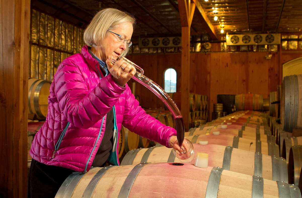 Winemaker Cathy Corison pulls a sample of the 2011 Cabernet in the barrel at her winery in St. Helena, Calif., on Friday, December 16, 2011.