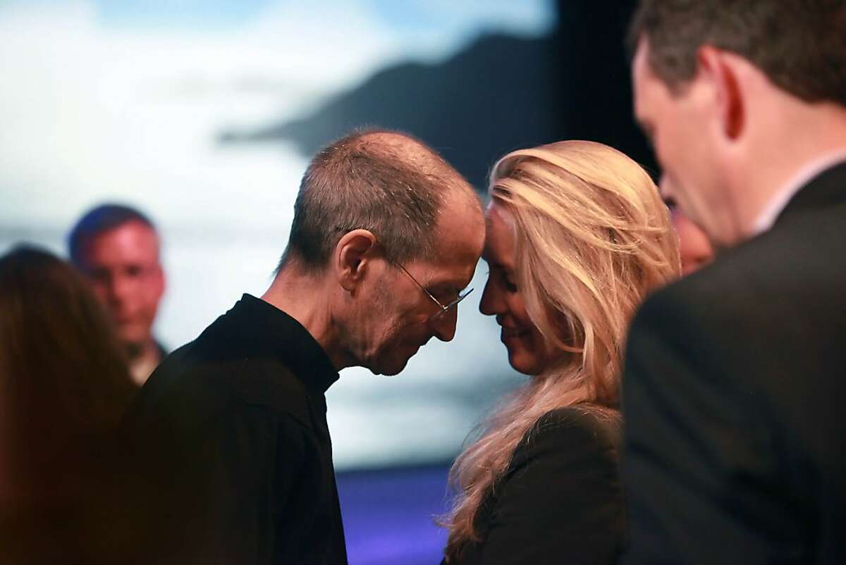 Steve Jobs, Apple CEO, leans his forehead against his wife, Laurene Powell Jobs, after delivering the keynote address to the Apple Worldwide Developers Conference at Moscone West in San Francisco, Calif., Monday, June 6, 2011.