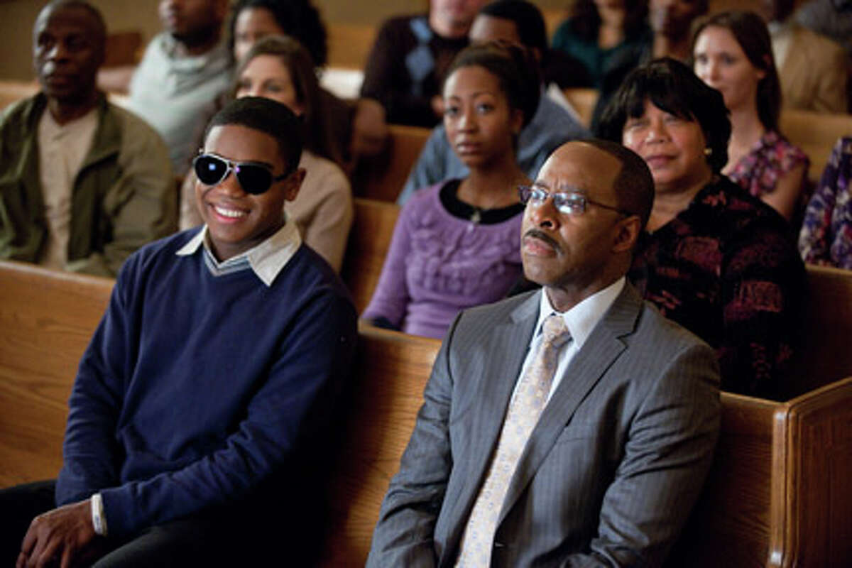 (L-R) Dexter Darden as Walter Hill and Courtney B. Vance as Pastor Dale in "Joyful Noise."