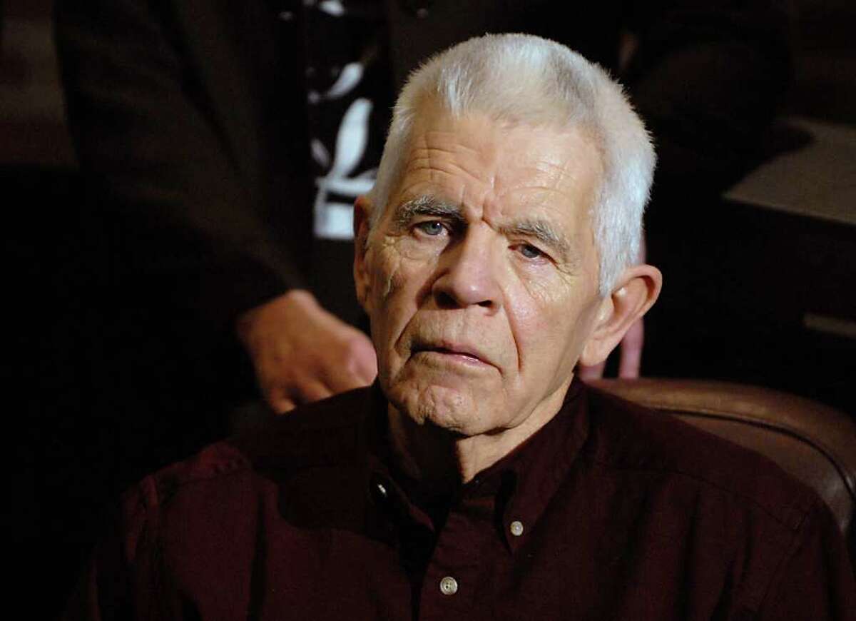 Donald Miles, the brother-in-law and "father figure" of David Bacon, who gave a victim impact statement to the court on behalf of the family, listens to DA James Murphy talk during a press conference after the sentencing of Nelson Costello in Ballston Spa, NY on January 15, 2010. Nelson Costello who admitted in October that he killed a romantic rival 40 years ago was sentenced to a maximum of 17 years in state prison today. (Lori Van Buren / Times Union)