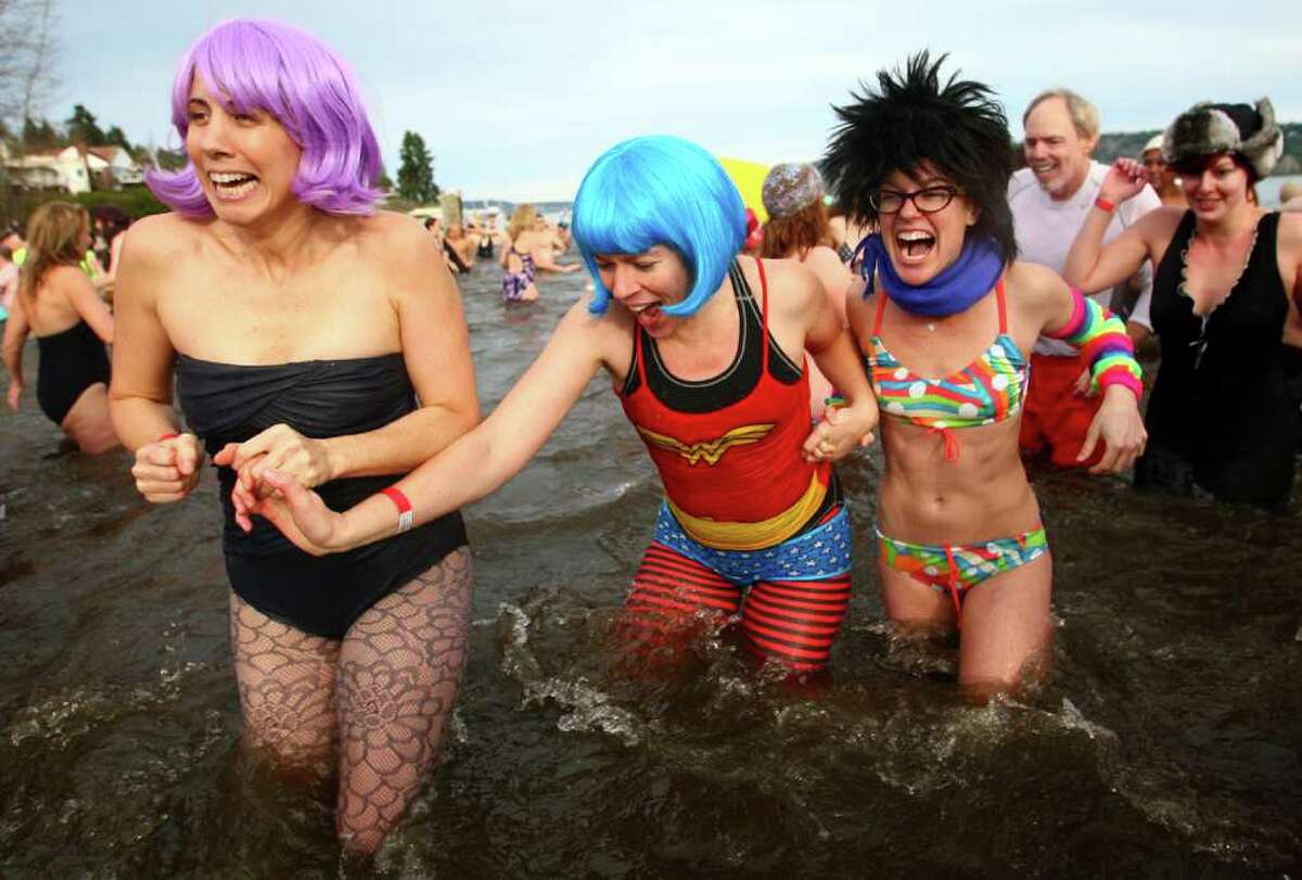 Participants brave the 49-degree Lake Washington water during the annual Polar Bear Plunge at Matthews Beach in Seattle on Sunday, January 1, 2011. The 10th annual New Year tradition saw one of its largest turnouts as people waded, ran and dove into the cold water.