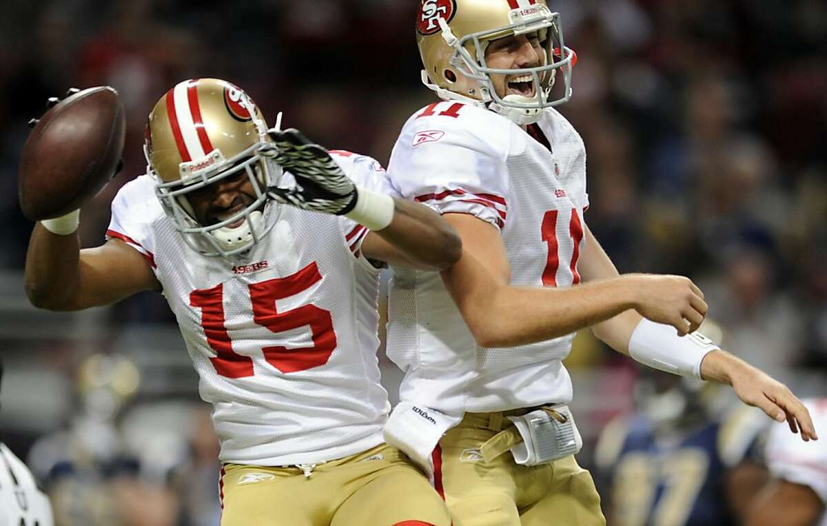San Francisco 49ers wide receiver Michael Crabtree (15) is congratulated by teammate quarterback Alex Smith on his 28-yard touchdown catch during the second quarter of an NFL football game against the St. Louis Rams on Sunday, Jan. 1, 2012, in St. Louis. (AP Photo/L.G. Patterson)