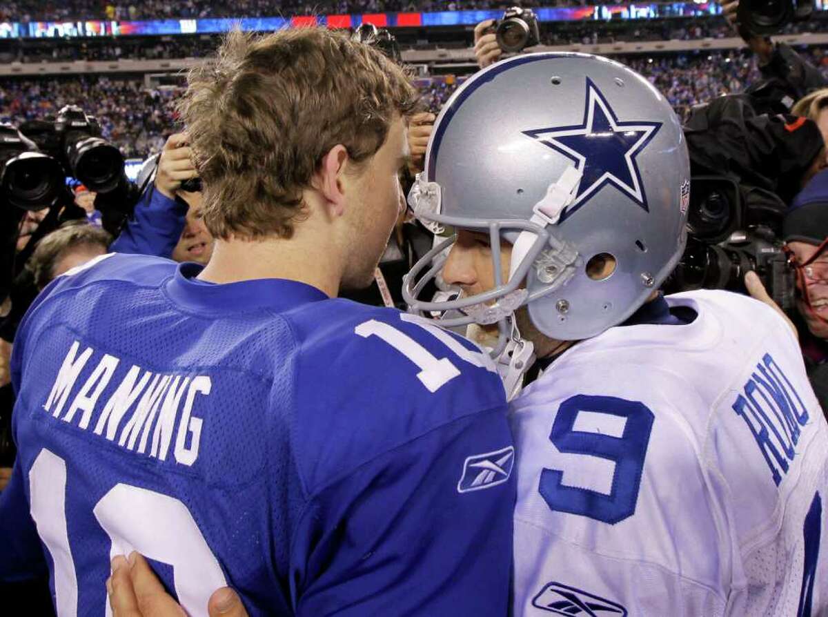Dallas Cowboys quarterback Tony Romo (9) chats with New York Giants quarterback Eli Manning after their NFL football game Sunday, Jan. 1, 2012, in East Rutherford, N.J. The Giants defeated the Cowboys 31-14.