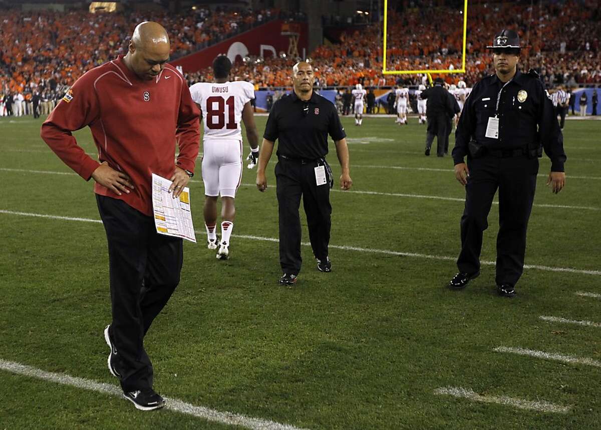 Stanford head coach David Shaw walks off the field as the Cardinal loses to Oklahoma State Cowboys 41-38 in overtime of the Fiesta Bowl game in Glendale, Ariz. on Monday, Jan. 2, 2012.