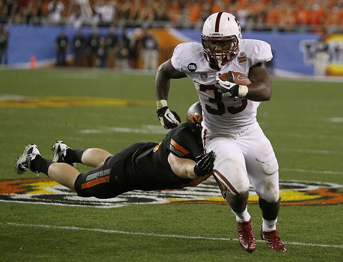 Stanford runningback Stepfan Taylor runs for a first down in the third quarter of the Fiesta Bowl game against the Oklahoma State Cowboys in Glendale, Ariz. on Monday, Jan. 2, 2012.