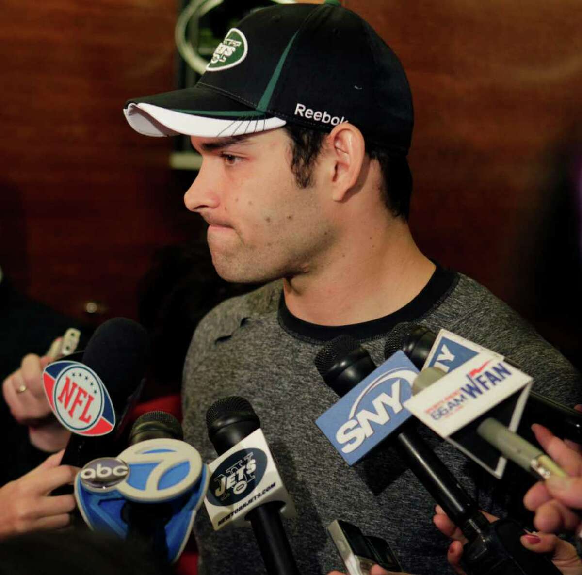 New York Jets quarterback Mark Sanchez talks to reporters in the Jets' locker room in Florham Park, N.J., Monday, Jan. 2, 2012. The Jets are going home after a season filled with inconsistent play, some in-fighting and lost opportunities. (AP Photo/Seth Wenig)