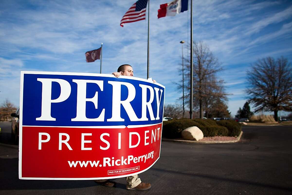 WEST DES MOINES, IA - JANUARY 3: Bob DiGregorio, a supporter of Republican presidential candidate, Texas Gov. Rick Perry, leaves a caucus training session held at the Sheraton January 3, 2012 in West Des Moines, Iowa. After months of campaigning by candidates, Iowan voters throughout the state prepare to participate in the first caucus of the 2012 presidential election. (Photo by Jonathan Gibby/Getty Images) *** BESTPIX ***