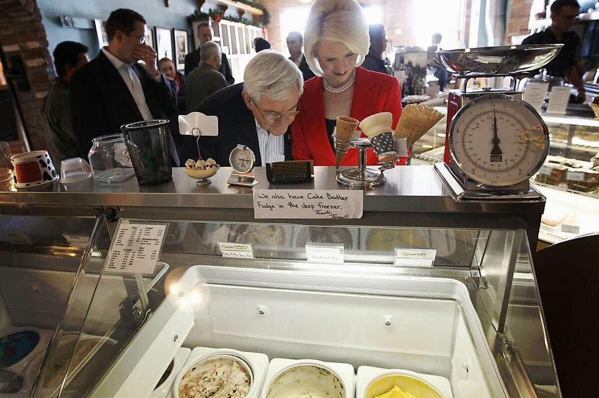 Republican presidential candidate, former House Speaker Newt Gingrich, ad his wife Callista, look over the ice cream selection as he campaigns at Elly's Tea and Coffee House in Muscatine, Iowa, Tuesday, Jan. 3, 2012. (AP Photo/Charles Dharapak)