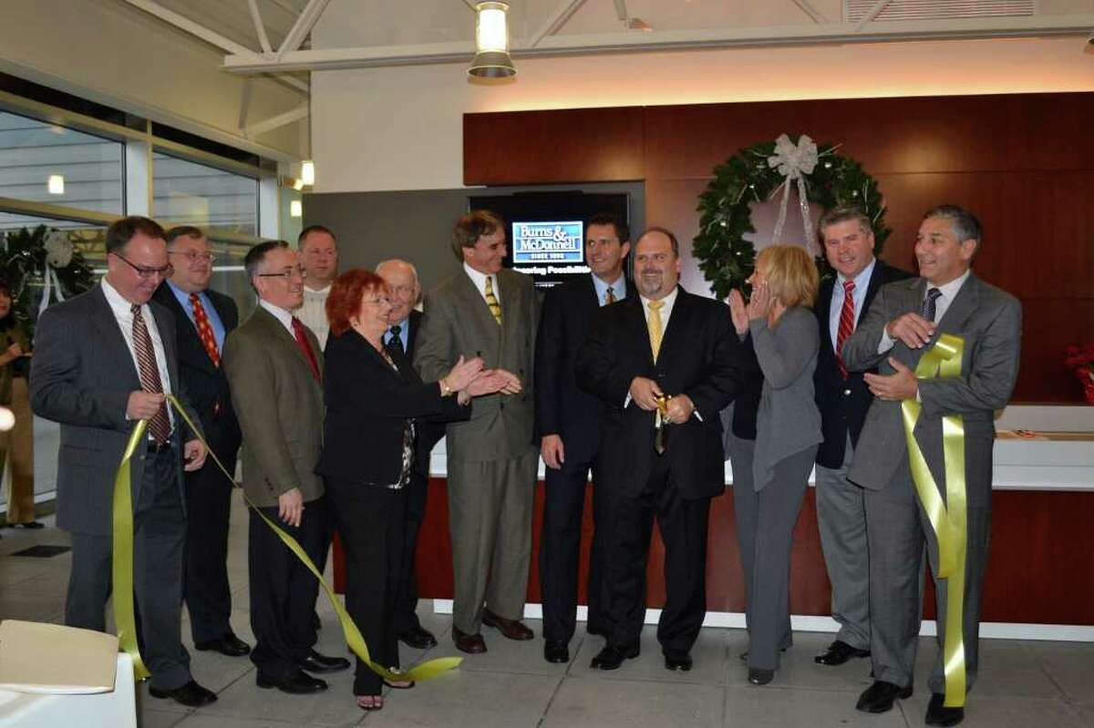 Business, political, and community leaders attended the official ribbon cutting ceremony held at Burns & McDonnell's new offices in Wallingford. Brett Williams, senior vice president of Burns & McDonnell was joined by Wallingford Mayor William Dickinson, State Senator Len Fasano, State Representative Alfred Adinolfi, State Representative Vin Candelora, Quinnipiac Chamber of Commerce President Robin Wilson, and local Wallingford leaders to officially celebrate the grand opening of the Campus at Greenhill facility in Wallingford.
