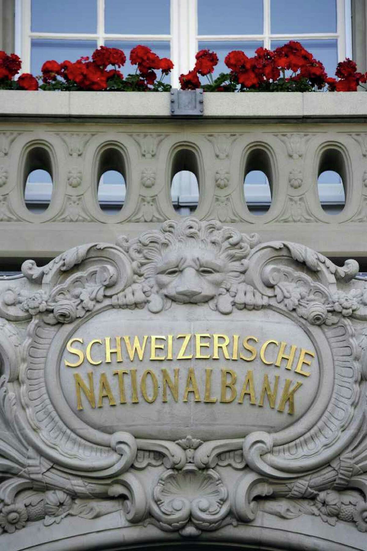 Swiss National Bank chief Philipp Hildebrand and his wife reportedly profited as he led efforts to lower the Swiss franc's value. After withering criticism, the bank released its guidelines for senior officials.