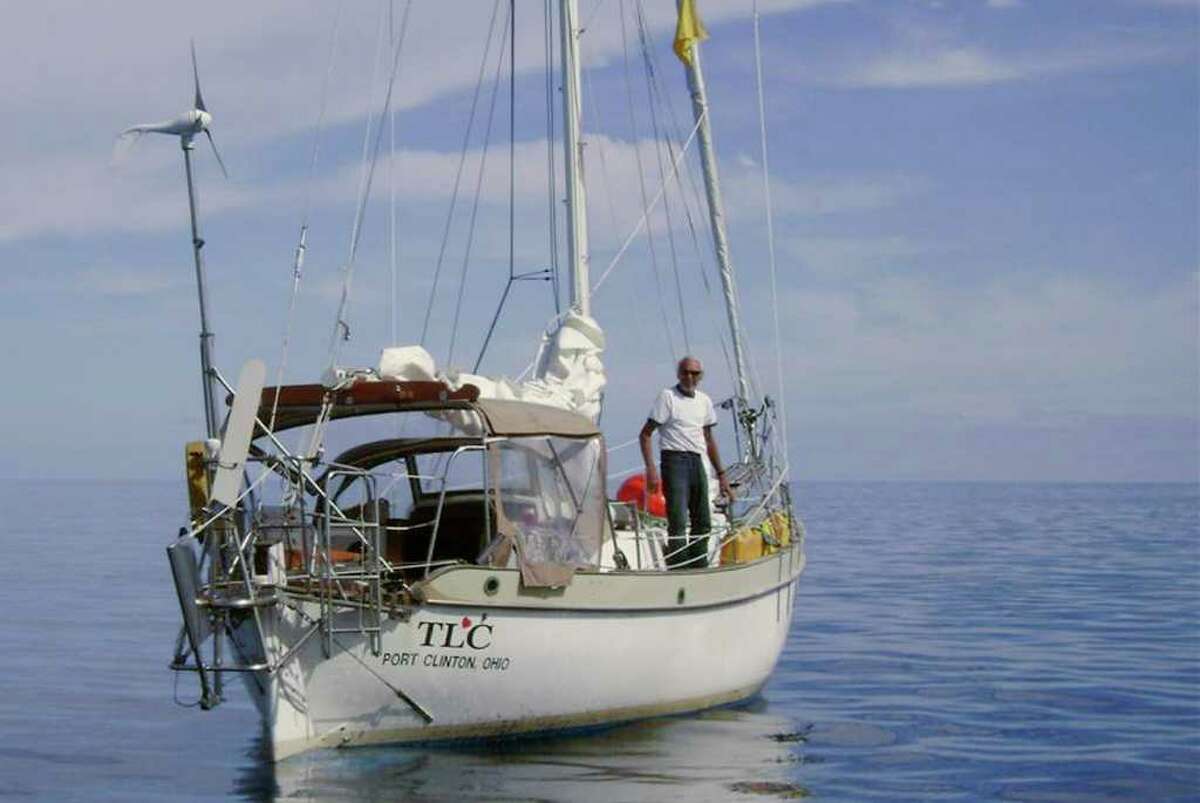 In this Dec. 2011 handout photo released by Amada de Chile, U.S. sailor Thomas Louis Corogin is seen on deck of his boat days before sail, in the bay of Easter Island, Chile. The 84-year American making his seventh attempt to sail alone around the tip of South America was found tired but alive by the Chilean Navy on Wednesday after his mast broke. The Chilean Navy located Corogin on his 32-foot sailboat more than 520 miles or 850 kilometers, south of Easter Island, stranded but in relatively stable weather, with ocean swells of about 15 feet or 5 meters. (AP Photo/Armada de Chile)