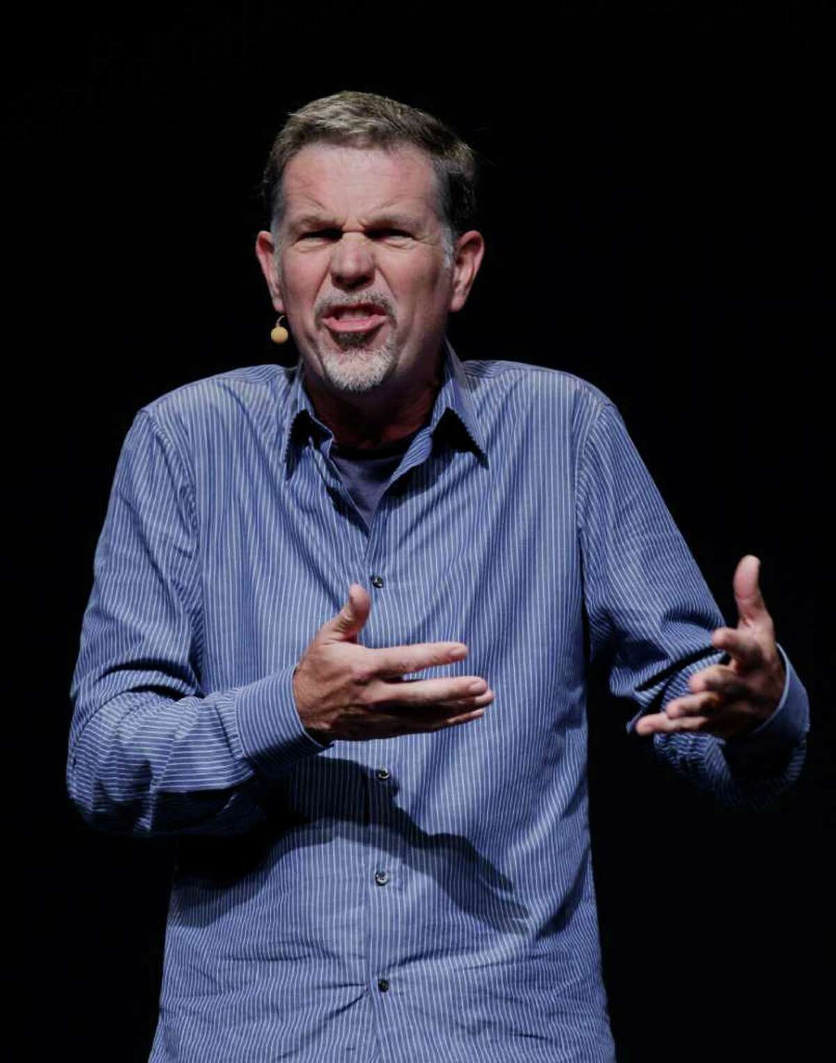 FILE - In this Sept. 23, 2011 file photo, Netflix CEO Reed Hastings gestures during the Facebook f/8 conference in San Francisco. To hear Hastings tell it, the bone-headed decisions that have dragged down the Internet's leading video subscription service during the past five months eventually will be forgotten like a bad movie made by a great film director.(AP Photo/Paul Sakuma, File)