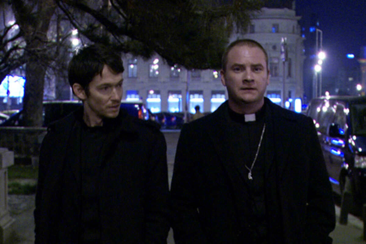 (L-R) Simon Quarterman as Fr. Ben Rawlings and Evan Helmuth as Fr. David Keane in "The Devil Inside."